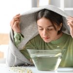 Young,Woman,Doing,Steam,Inhalation,At,Home,To,Soothe,And