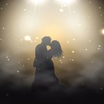 Bride and groom under spotlight